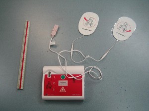 AED trainer with adult pads