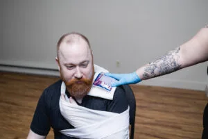 Sling application for first aid and CPR training